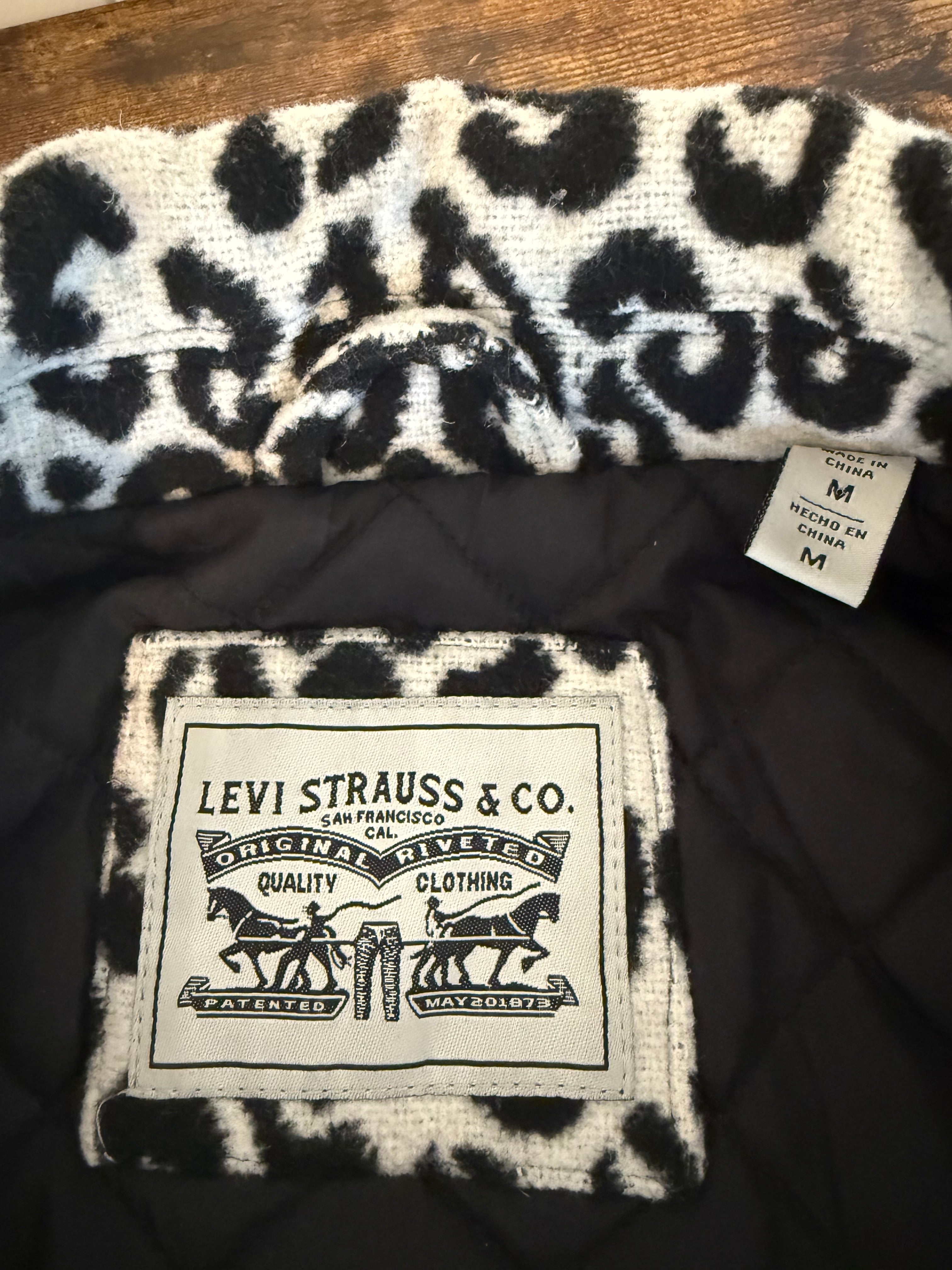 Levi Strauss & Co. branded product with leopard print design on a dark background