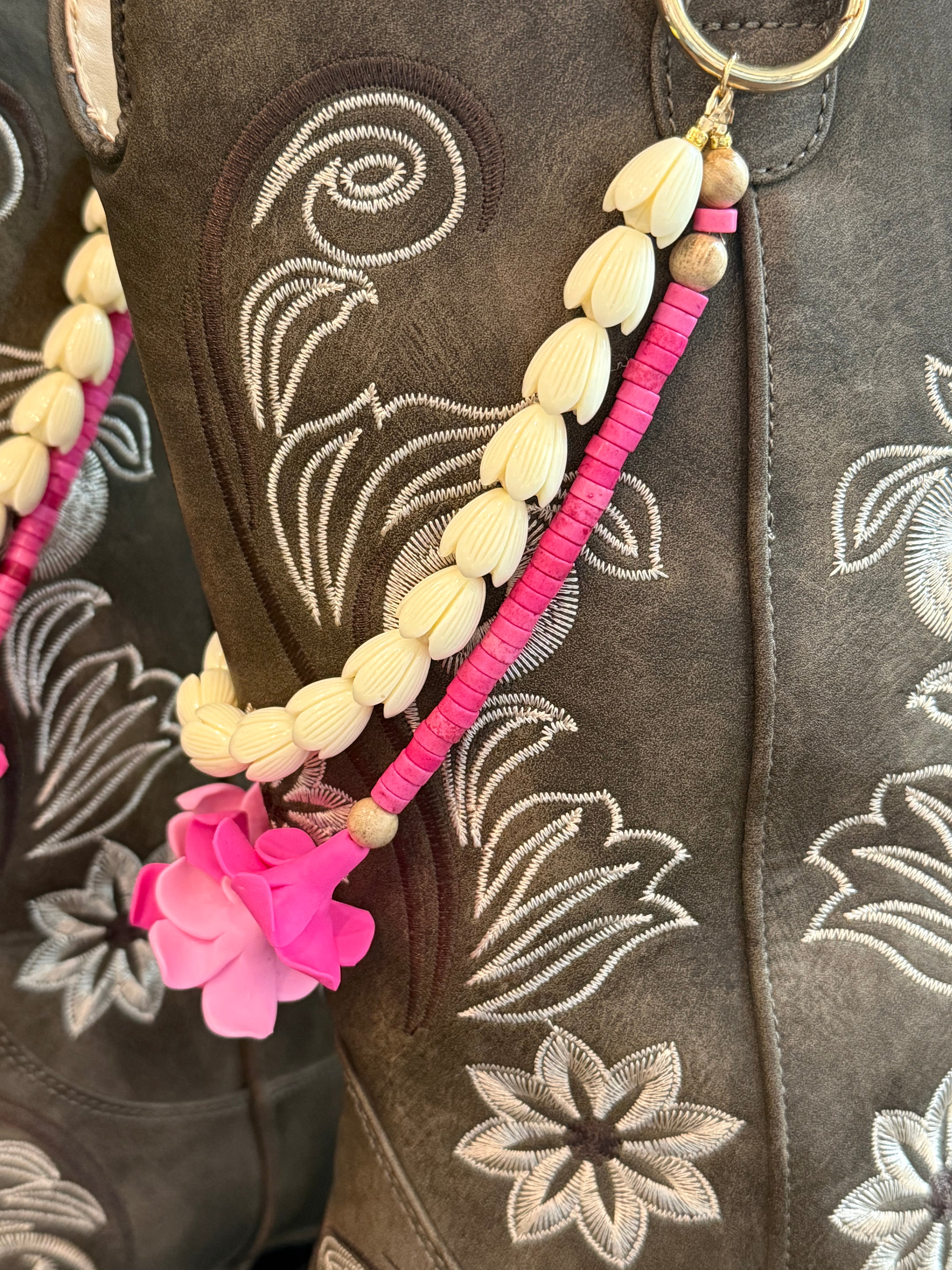 brown boots with decorative beaded double  lei with pink clay flowers and white piakake beads