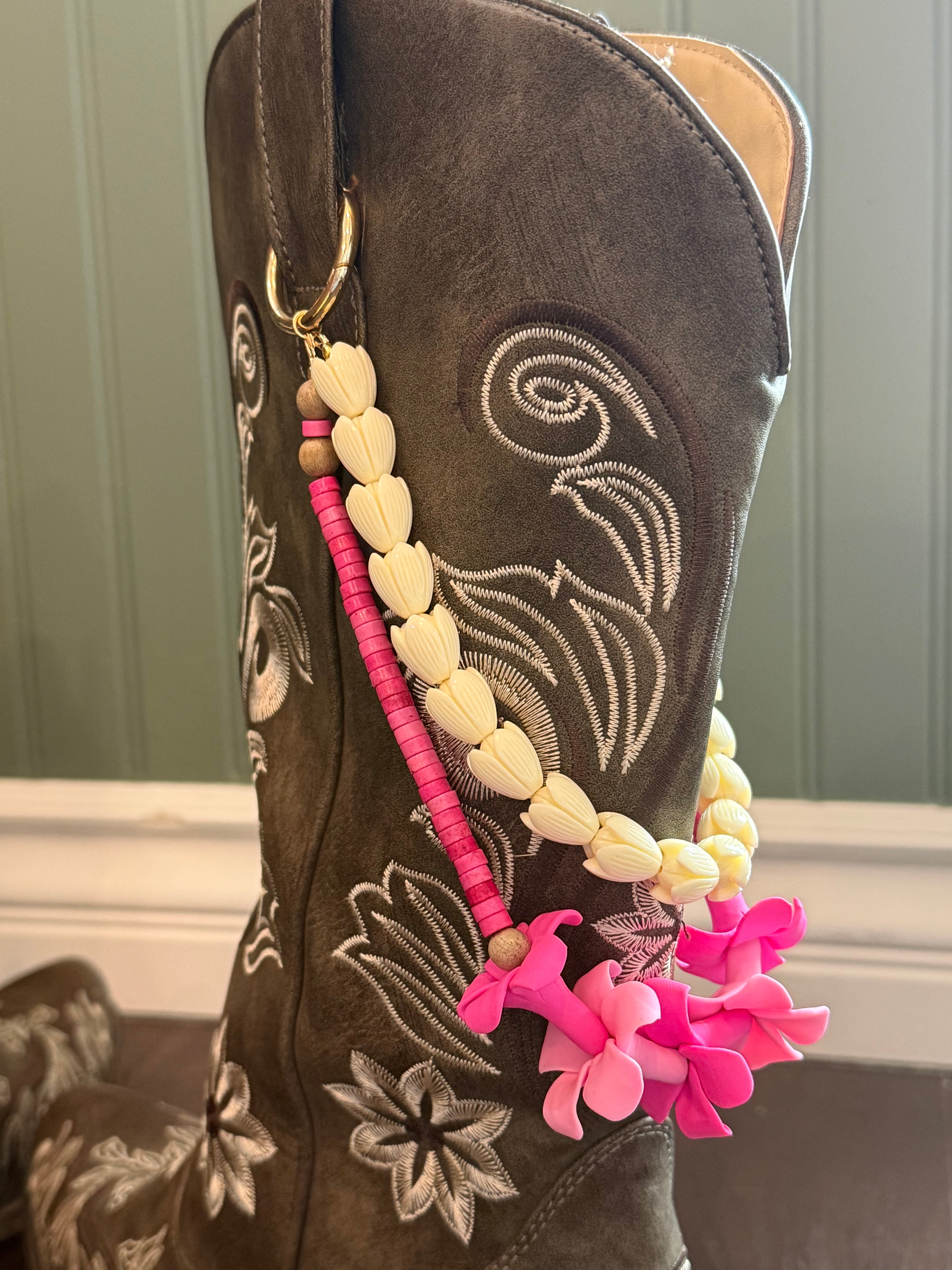 brown boots with decorative beaded double  lei with pink clay flowers and white piakake beads