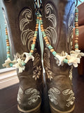 brown boots with decorative beaded lei with clay flowers and turquoise beads