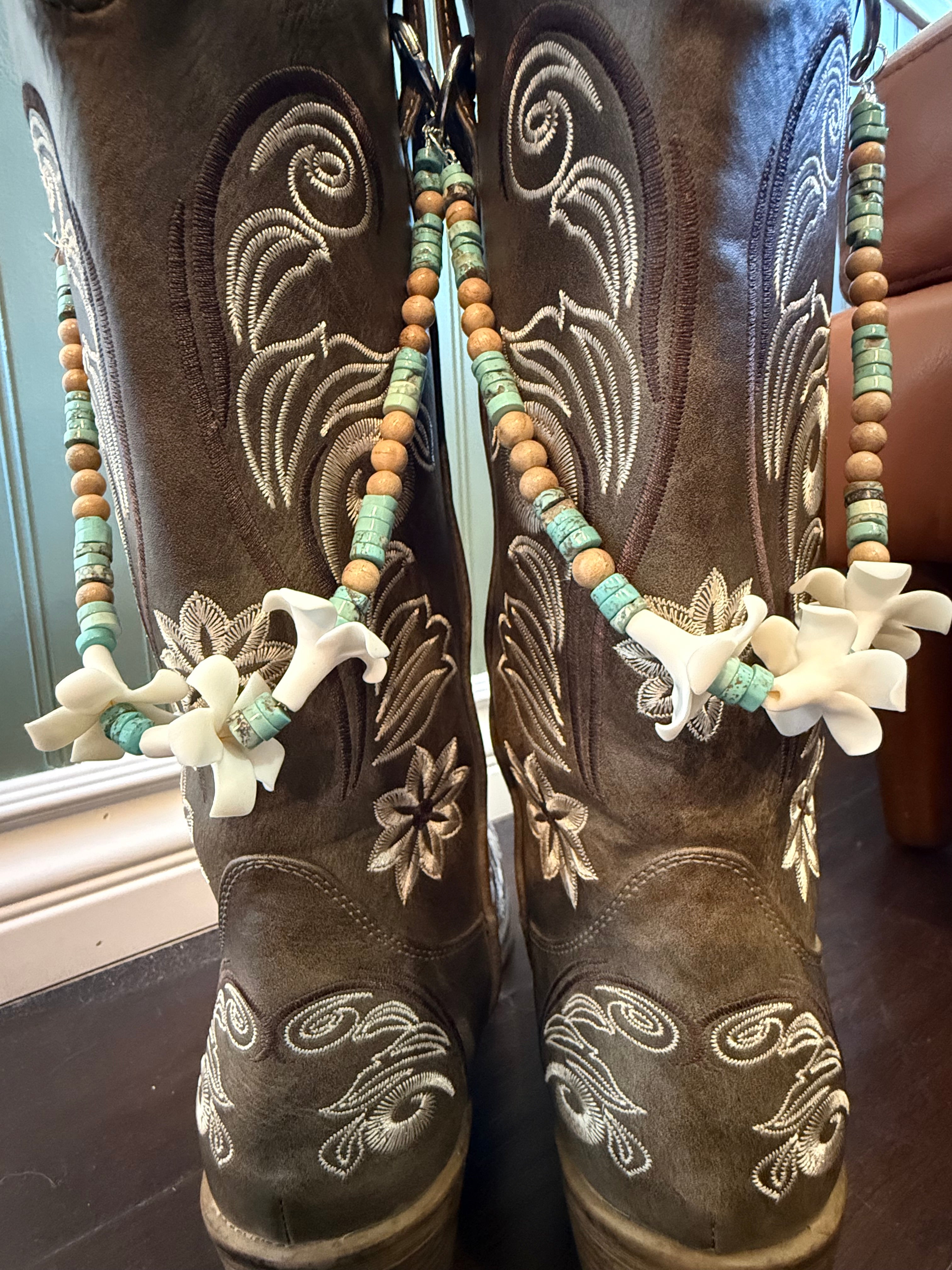 brown boots with decorative beaded lei with clay flowers and turquoise beads